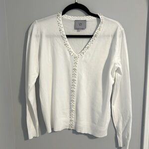 White v neck sweater with pearl embellishments size large.